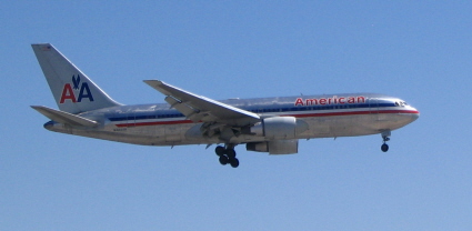 Airliner landing showing its flaps extended and down so as to reduce its speed and decrease its stall 
speed